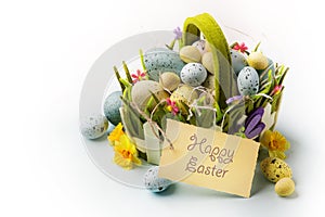 Art Easter eggs basket on wooden background