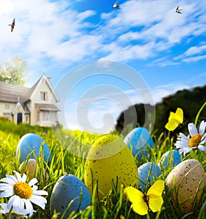 Art easter eggs on spring field