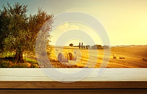 Art Empty wooden deck table on traditional italian rural landscape background