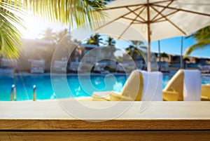 Art Empty wooden table on sunny blurred tropical pool  background. Outdoor party mockup for design and product display