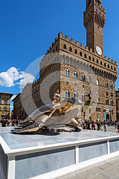 Art exhibition in Piazza della Signoria in Florence with a bronze turtle