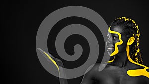 The Art Face. Black and yellow body paint on african woman. Abstract creative portrait. Copy space for your text