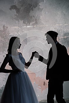 Art fashion studio photo of wedding couple silhouette groom and bride on colors background. Art Wedding style