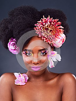 Art, flowers and portrait of black woman in studio for beauty, creative and spring. Natural, cosmetics and floral with