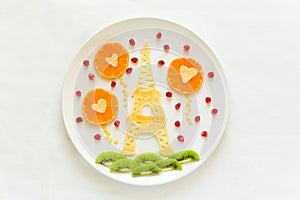 Art food concept. Eiffel Tower with silhouette of a couple in love and heart shaped balls