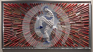 Art inside Globe Life Field in Arlington, Texas, featuring a pitcher made of balls, surrounded by broken and unbroken bats.