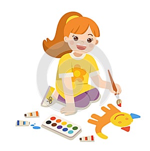 Art kid. Back to School. Happy Girl paints pictures on floor.