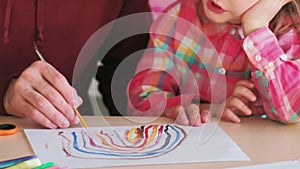 art lesson tutor man child girl painting