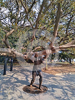 Art, man holding the tree