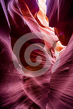 Art of natural scenery in Lower Antelope Canyon in Page Arizona with bright sandstones stacked in flaky fire waves in a narrow