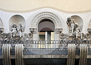 Art nouveau balcony with children figures