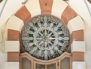 Art nouveau style window with forged metal details