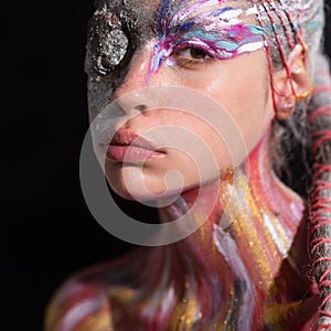 Art nude Portrait of young woman with art make-up. The Body Art. Abstract face paint. Sexy Model with creative art