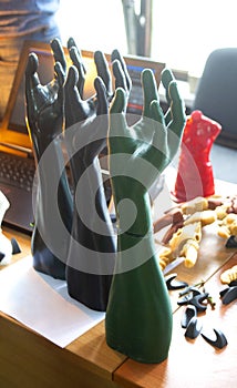 Art Object human hands printed 3D printer. Model prototype of human hand printed