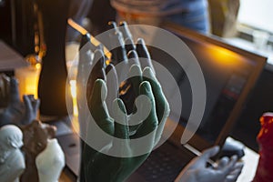 Art Object human hands printed 3D printer. Model prototype of human hand printed