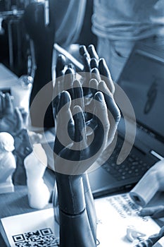 Art Object human hands printed 3D printer. Model prototype of human hand printed