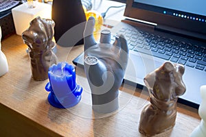 Art Object human hands printed 3D printer. Model prototype of human hand printed