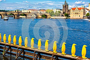 Art object march of yellow penguins. Weird art statues of Prague