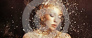 Art photo of golden woman splintering to thousands elements