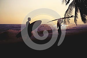 Art photo styles of silhouette surfer on beach at sunset