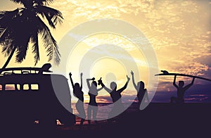 Art photo styles of silhouette surfer party on beach at sunset