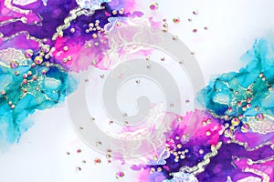 art photography of abstract fluid art painting with alcohol ink blue, purple, pink, gold colors and crystal rhinestones