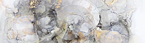 art photography of abstract fluid art painting with alcohol ink, black, gray and gold colors photo