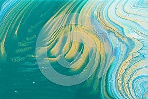 Art photography of abstract marbleized effect background. turquoise, emerald green, blue, white and gold creative colors.