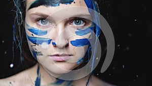 Art portrait confident woman blue warrior makeup