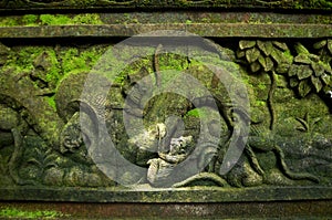 Art sculpture and carved antique deity angel god of hindu statue balinese style in Mandala Suci Wenara Wana or Ubud Sacred Monkey