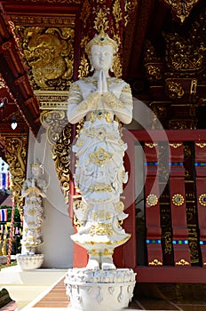 Art sculpture deity statue or carving angel figure lanna style of Wat Phra Singh temple for thai people travelers visit respect