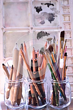 Art supplies in front of art palette.