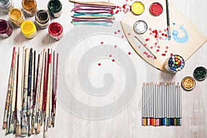 Art suppllies, pencils, paints, brushes