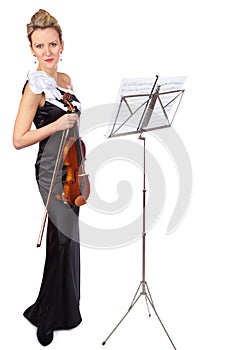 Art, violin and portrait of woman in studio, professional orchestra musician on white background with sheet music