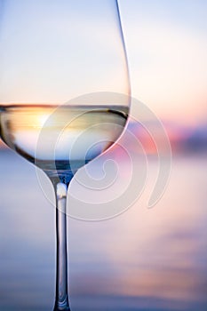 Art white wine on the sky background