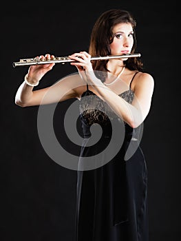 Art. Woman flutist flaustist musician playing flute