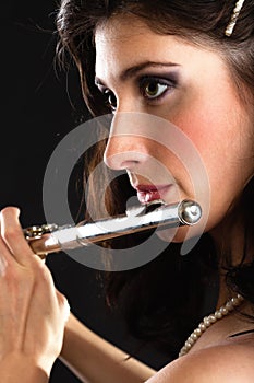 Art. Woman flutist flaustist musician playing flute