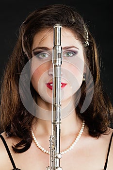 Art. Woman flutist flautist with flute. Music.