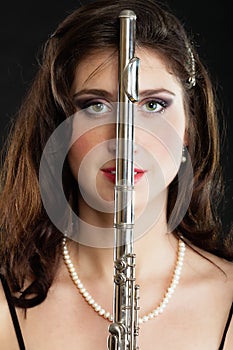 Art. Woman flutist flautist with flute. Music.