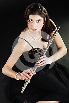 Art. Woman flutist flautist with flute. Music.