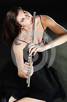 Art. Woman flutist flautist playing flute. Music.