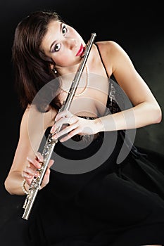 Art. Woman flutist flautist playing flute. Music.