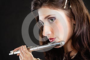 Art. Woman flutist flautist playing flute. Music.