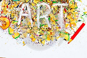 ART word on the background of colored pencil shavings