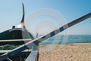 Arte Xavega typical portuguese old fishing boat on the beach in