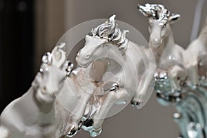 Artefact of beautiful white horses running