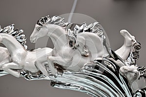 artefact,of beautiful white horses running