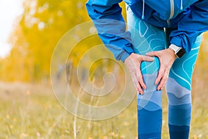 Arthritis athlete. Injuries - sports running knee injury woman.