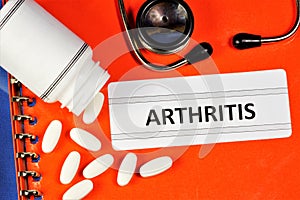 Arthritis is a joint disease of inflammatory etiology. Medical folder with a diagnosis, the stethoscope is a tool of the doctor,