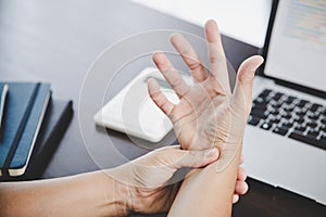 Arthritis person, finger woman ache from working in office. Concept office syndrome hand pain from occupational disease, woman